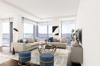 a living room filled with furniture and a large window